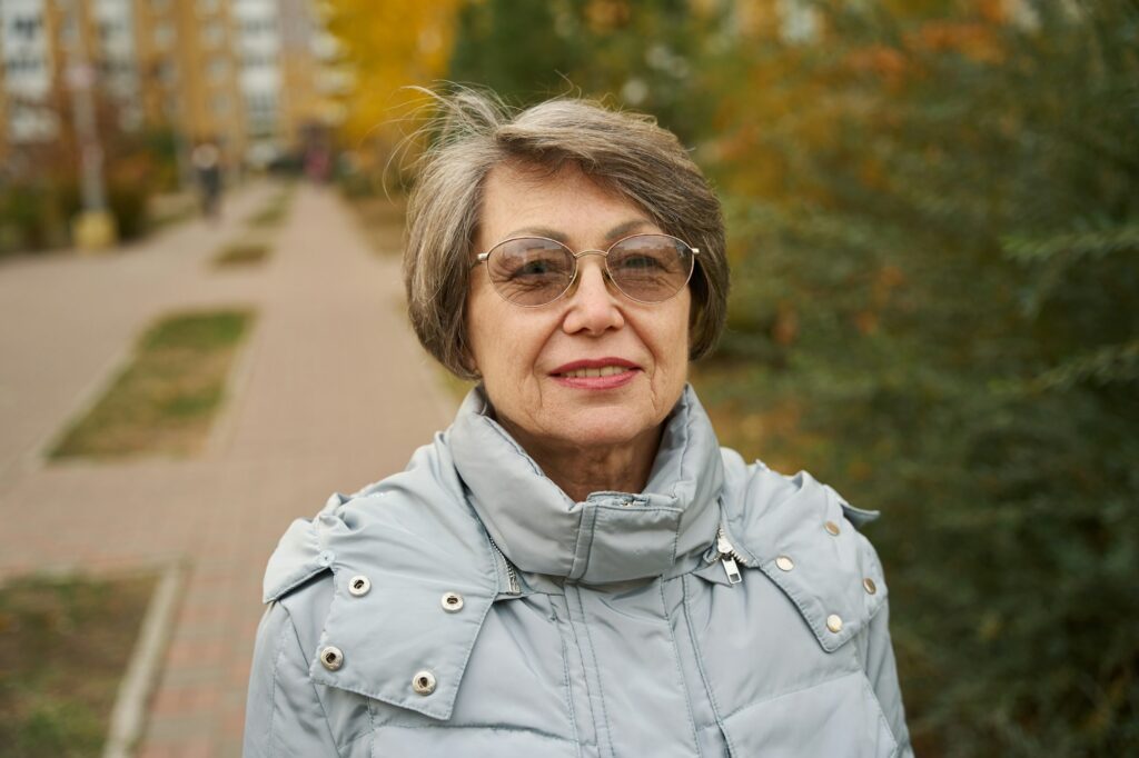 Close up photo of elder woman in glasses